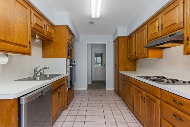 kitchen with light tile patterned flooring, sink, exhaust hood, and stainless steel appliances