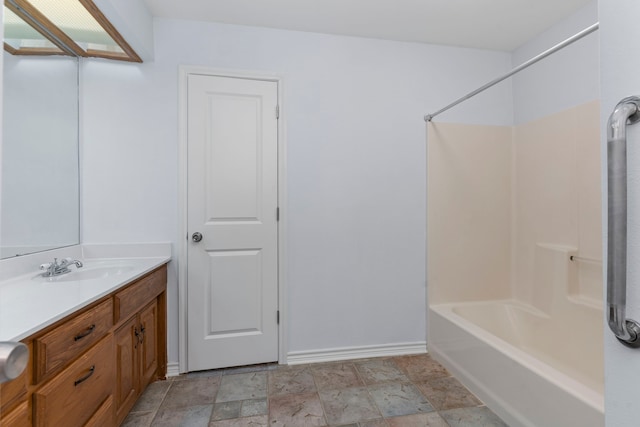 bathroom with vanity and  shower combination