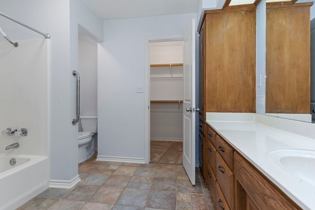 full bathroom featuring shower / bathing tub combination, vanity, and toilet