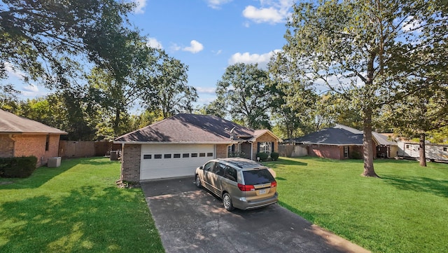 view of front of property featuring a front yard and a garage