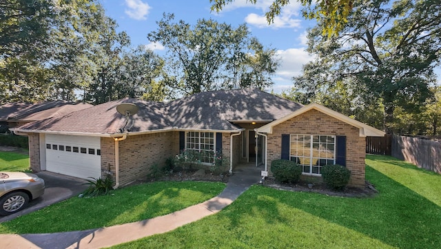 ranch-style house with a front yard and a garage