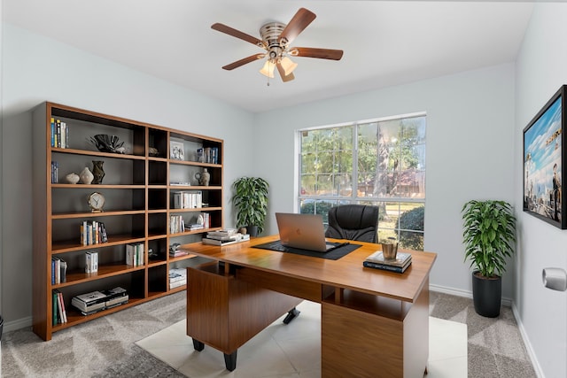 office space featuring ceiling fan and light colored carpet