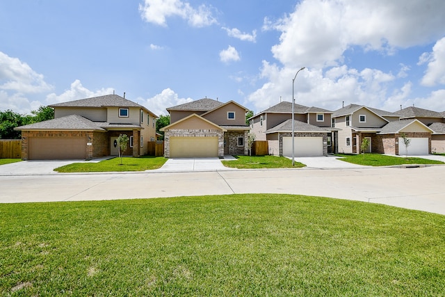 view of front of house featuring a front yard and a garage