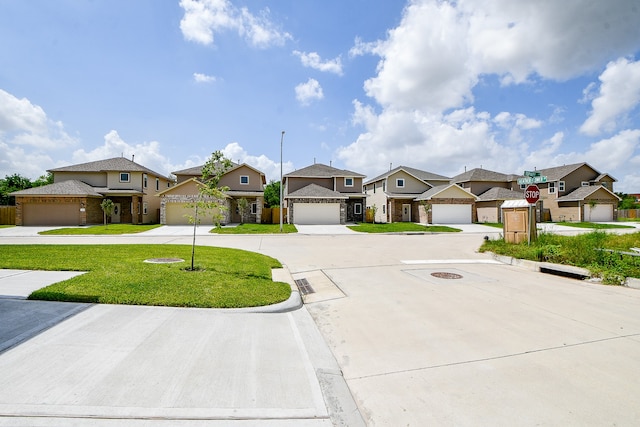 view of front facade featuring a front lawn and a garage