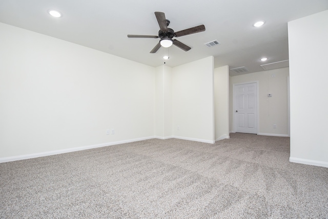 carpeted empty room featuring ceiling fan