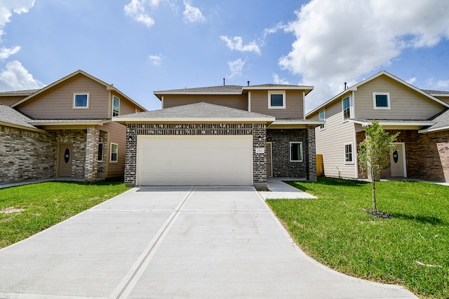 view of front of home with a garage and a front lawn