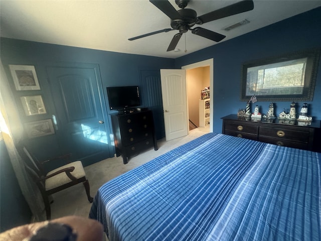 carpeted bedroom featuring ceiling fan