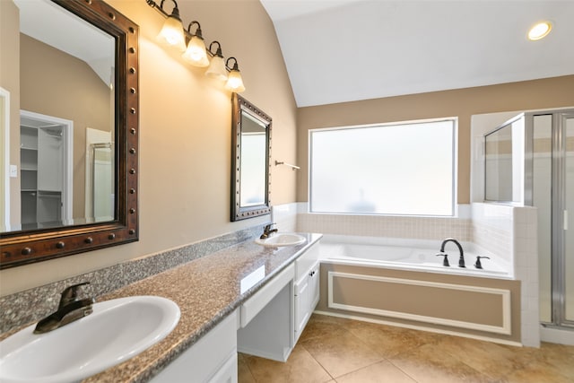 bathroom featuring separate shower and tub, tile patterned floors, vanity, and vaulted ceiling