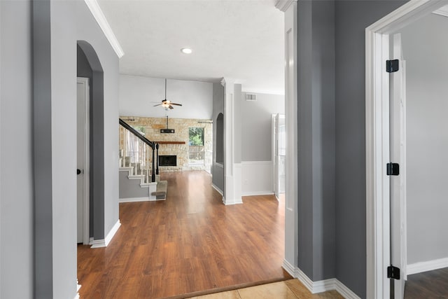 hall with hardwood / wood-style flooring and ornamental molding