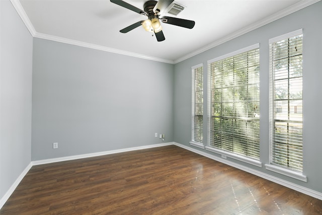 unfurnished room with ceiling fan, a healthy amount of sunlight, dark hardwood / wood-style flooring, and ornamental molding