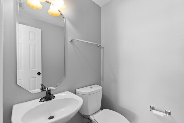 12546 Castlestone Dr, Houston, TX 77065 - half bath featuring a sink, toilet, and visible vents