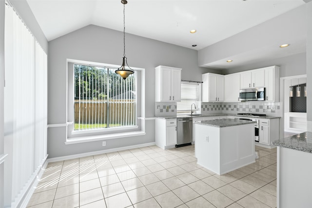 kitchen featuring white cabinets, lofted ceiling, and appliances with stainless steel finishes