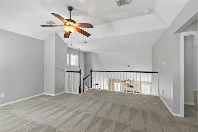 interior space with carpet flooring, ceiling fan, and lofted ceiling