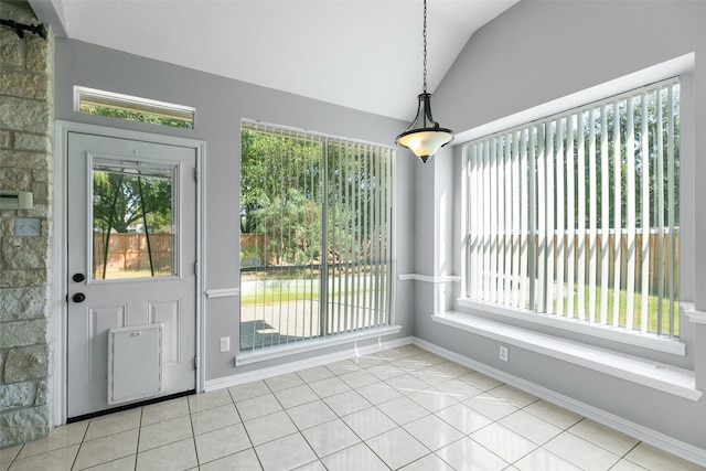 12546 Castlestone Dr, Houston, TX 77065 - unfurnished dining area featuring tile patterned flooring, plenty of natural light, baseboards, and vaulted ceiling