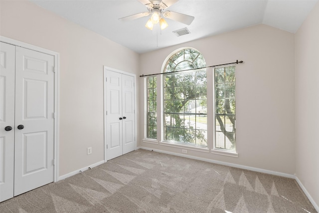 12546 Castlestone Dr, Houston, TX 77065 - unfurnished bedroom featuring visible vents, baseboards, carpet floors, and vaulted ceiling
