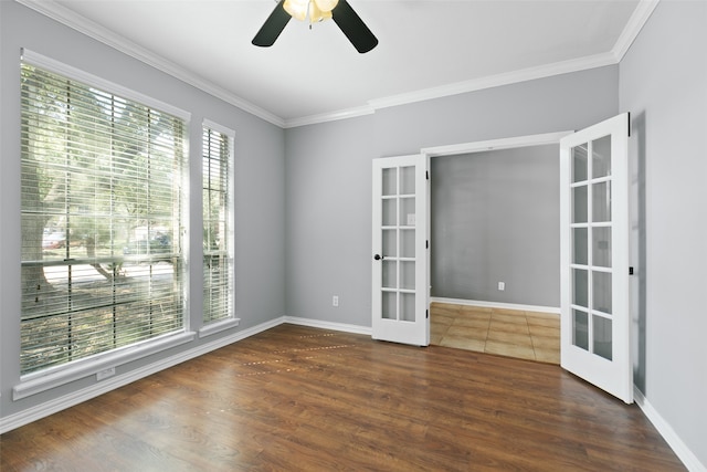 empty room featuring ceiling fan, ornamental molding, and french doors