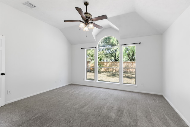 spare room featuring carpet flooring, ceiling fan, and vaulted ceiling