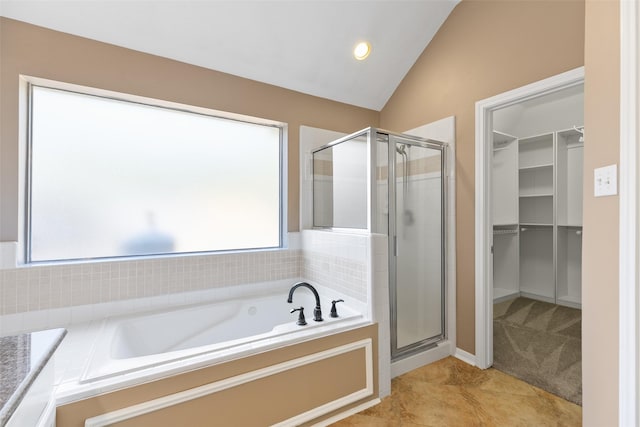 12546 Castlestone Dr, Houston, TX 77065 - full bathroom with recessed lighting, a bath, a spacious closet, a shower stall, and vaulted ceiling