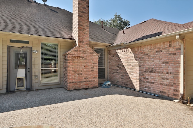 doorway to property featuring a patio area