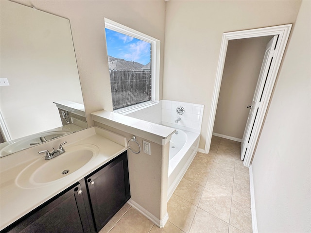 bathroom with vanity, tile patterned floors, and a bathtub