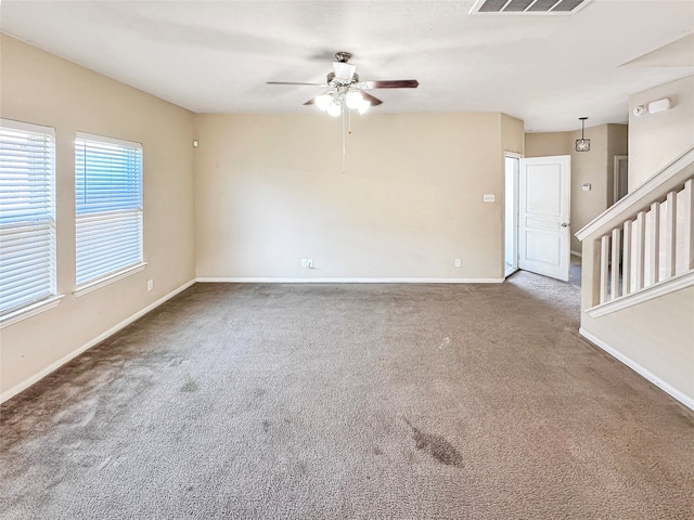 empty room with carpet and ceiling fan