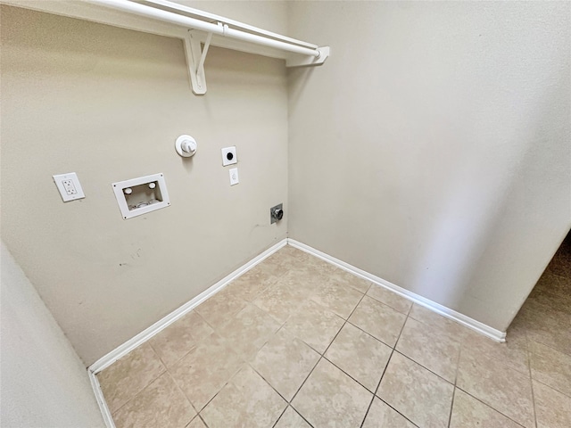 clothes washing area featuring hookup for an electric dryer, hookup for a washing machine, and light tile patterned floors