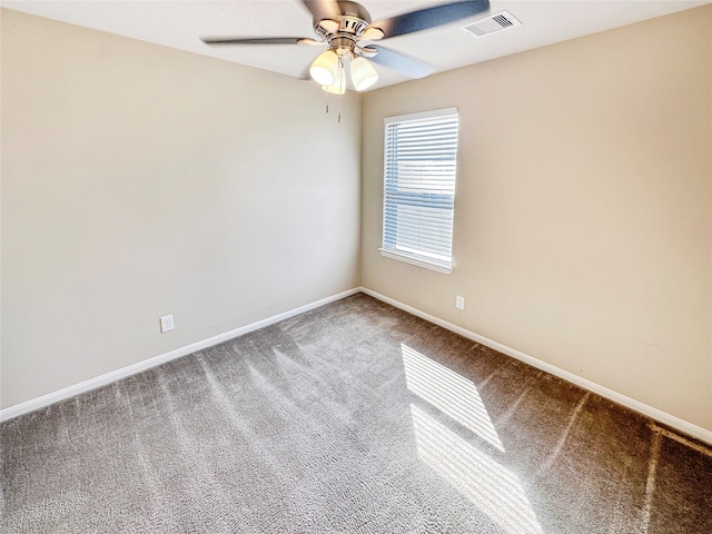 carpeted empty room featuring ceiling fan