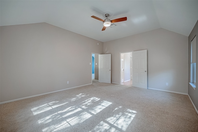 unfurnished bedroom with lofted ceiling, light carpet, and ceiling fan