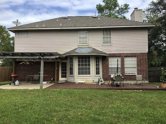 back of property featuring a patio and a lawn