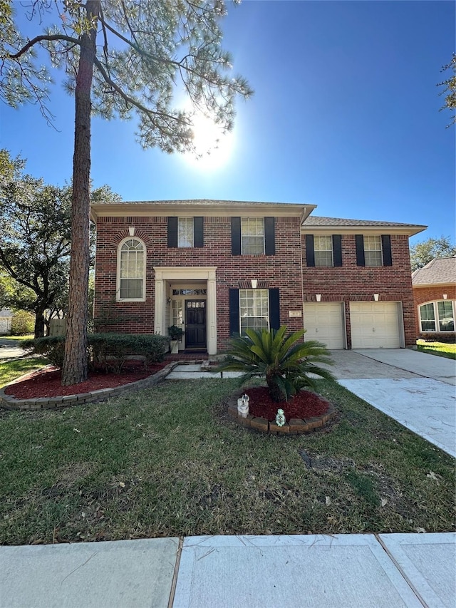 view of front facade featuring driveway, an attached garage, and brick siding
