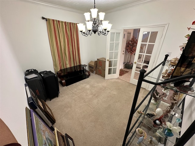 interior space with french doors, crown molding, carpet flooring, and a chandelier