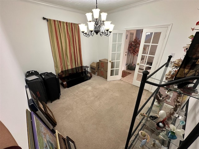 dining area with french doors, a chandelier, light carpet, and ornamental molding