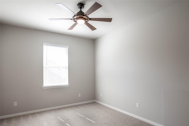 spare room featuring carpet floors and ceiling fan