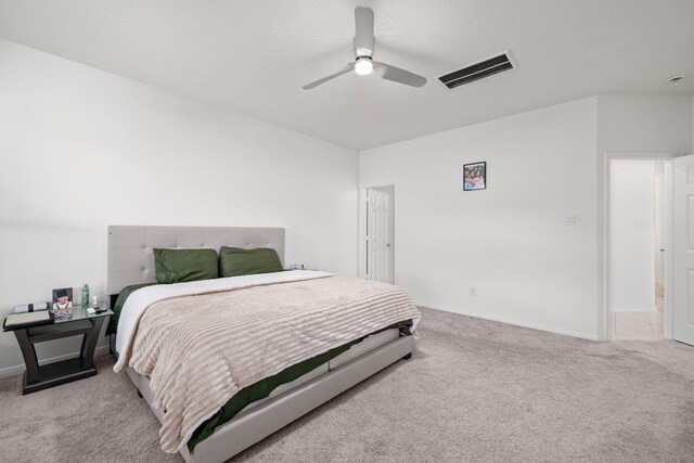 bedroom with ceiling fan and light colored carpet