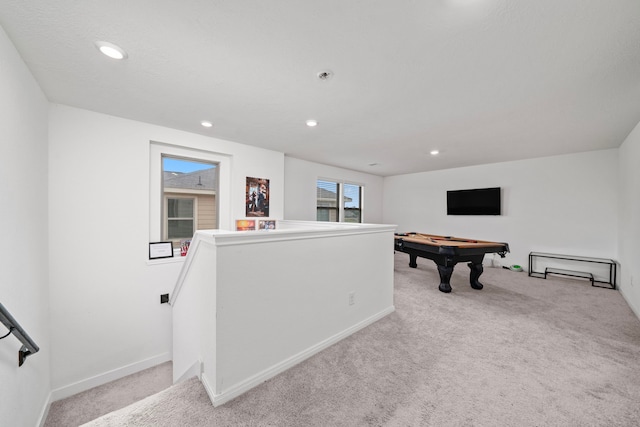 recreation room featuring light carpet, billiards, and a wealth of natural light