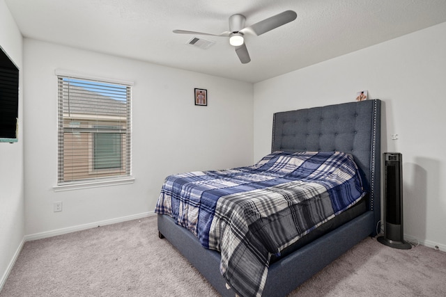 bedroom with light carpet and ceiling fan