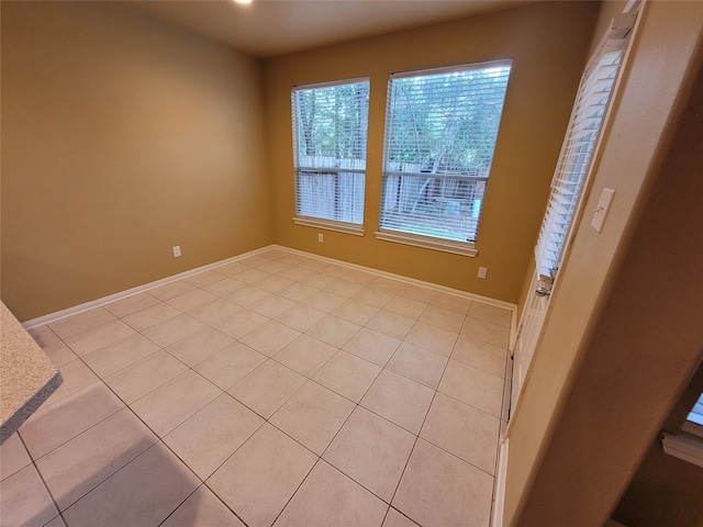 empty room with light tile patterned floors