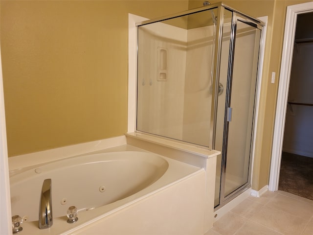 bathroom featuring independent shower and bath and tile patterned floors