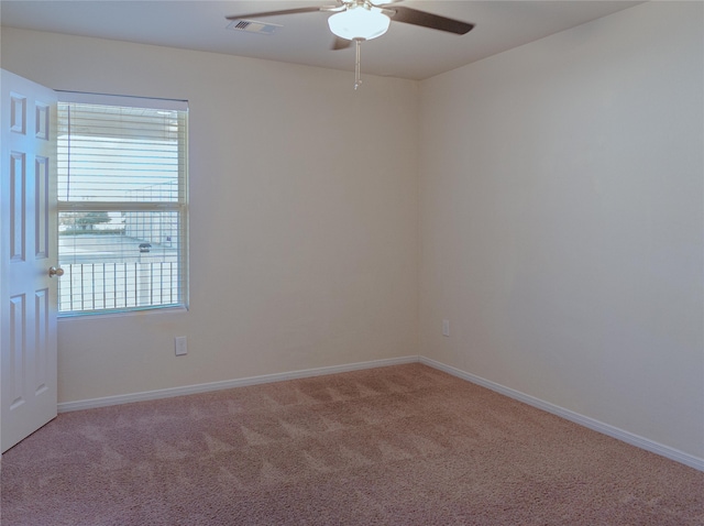 empty room with carpet floors and ceiling fan