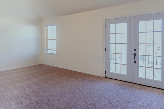 entryway with french doors and light carpet