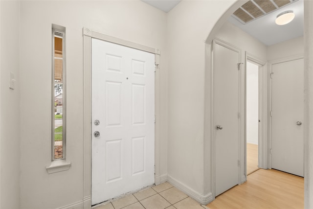 foyer entrance with light wood-type flooring