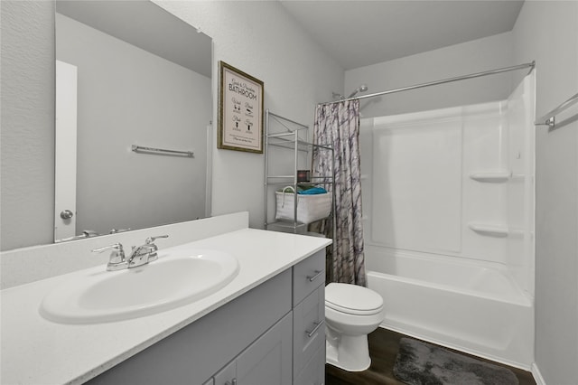 full bathroom with shower / tub combo, hardwood / wood-style flooring, vanity, and toilet