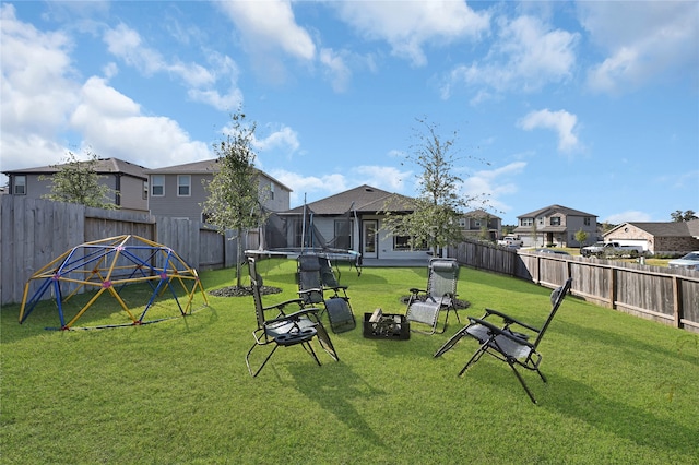 view of yard with a trampoline