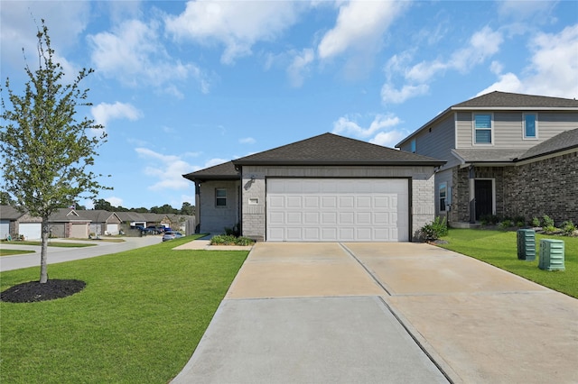 view of front facade with a front yard and a garage