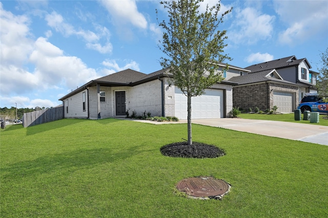 view of front facade with a front yard and a garage