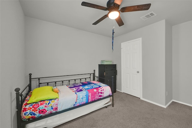 carpeted bedroom featuring ceiling fan