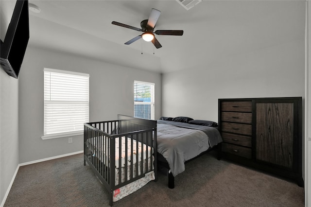 carpeted bedroom featuring vaulted ceiling and ceiling fan