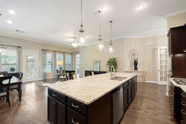 kitchen featuring an island with sink, sink, stainless steel dishwasher, and dark hardwood / wood-style flooring