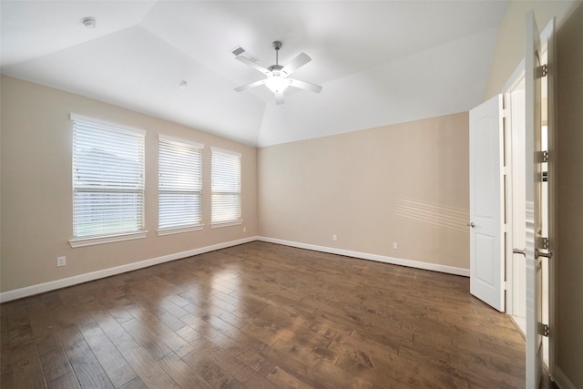 spare room with ceiling fan, lofted ceiling, and dark hardwood / wood-style flooring