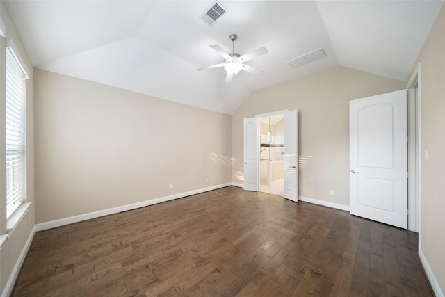 unfurnished bedroom with ceiling fan, ensuite bath, lofted ceiling, and dark hardwood / wood-style flooring